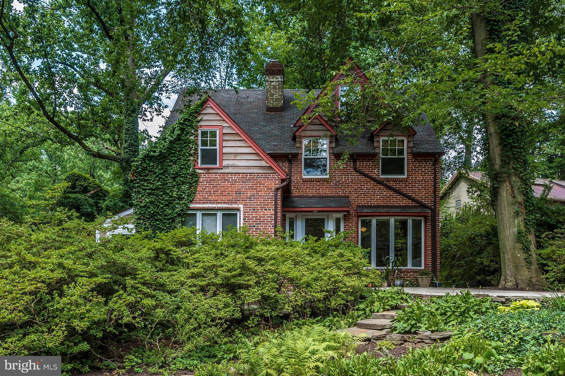 107 Sunnyside Road Silver Spring, MD 20910 - Photo 1 of 26 a front view of a house with a yard