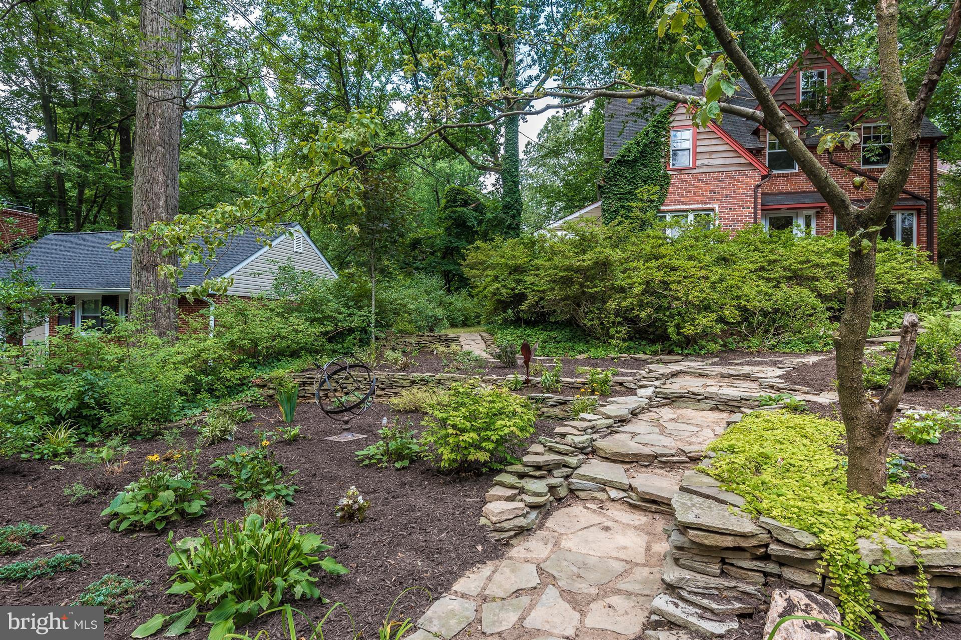 107 Sunnyside Road Silver Spring, MD 20910 - Photo 2 of 26 a backyard of a house with lots of green space and fountain