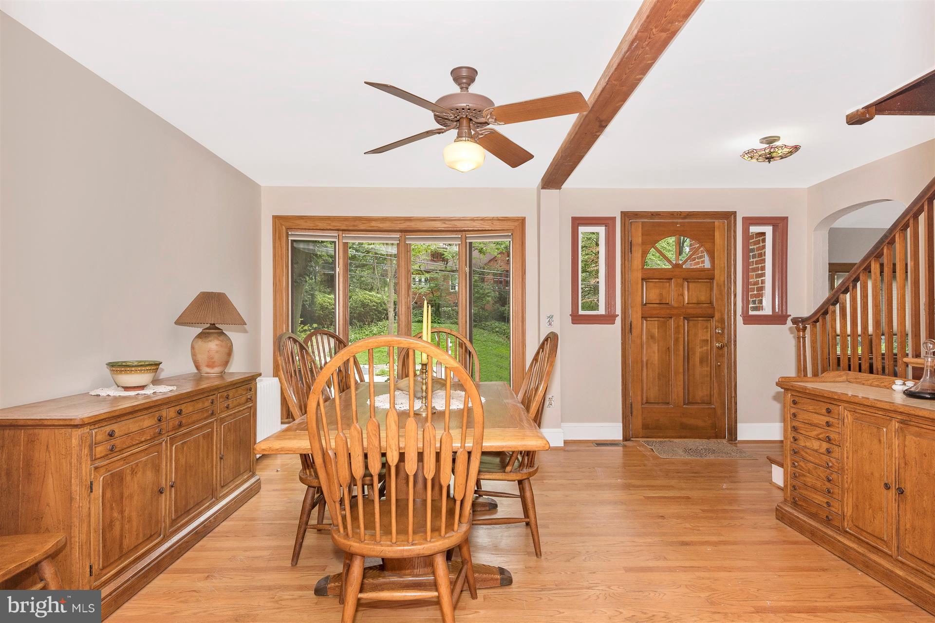 107 Sunnyside Road Silver Spring, MD 20910 - Photo 12 of 26 a view of a dining room with furniture window and wooden floor