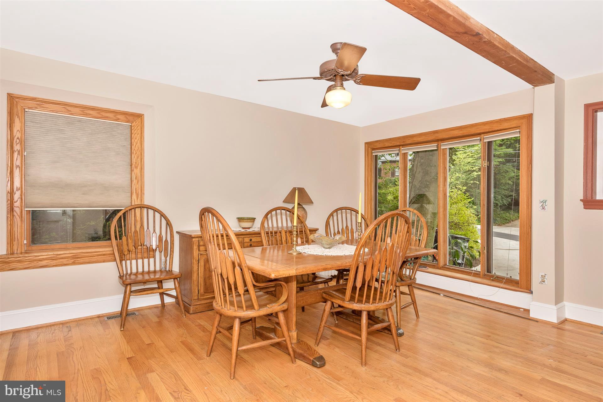 107 Sunnyside Road Silver Spring, MD 20910 - Photo 13 of 26 a view of a dining room with furniture window and wooden floor