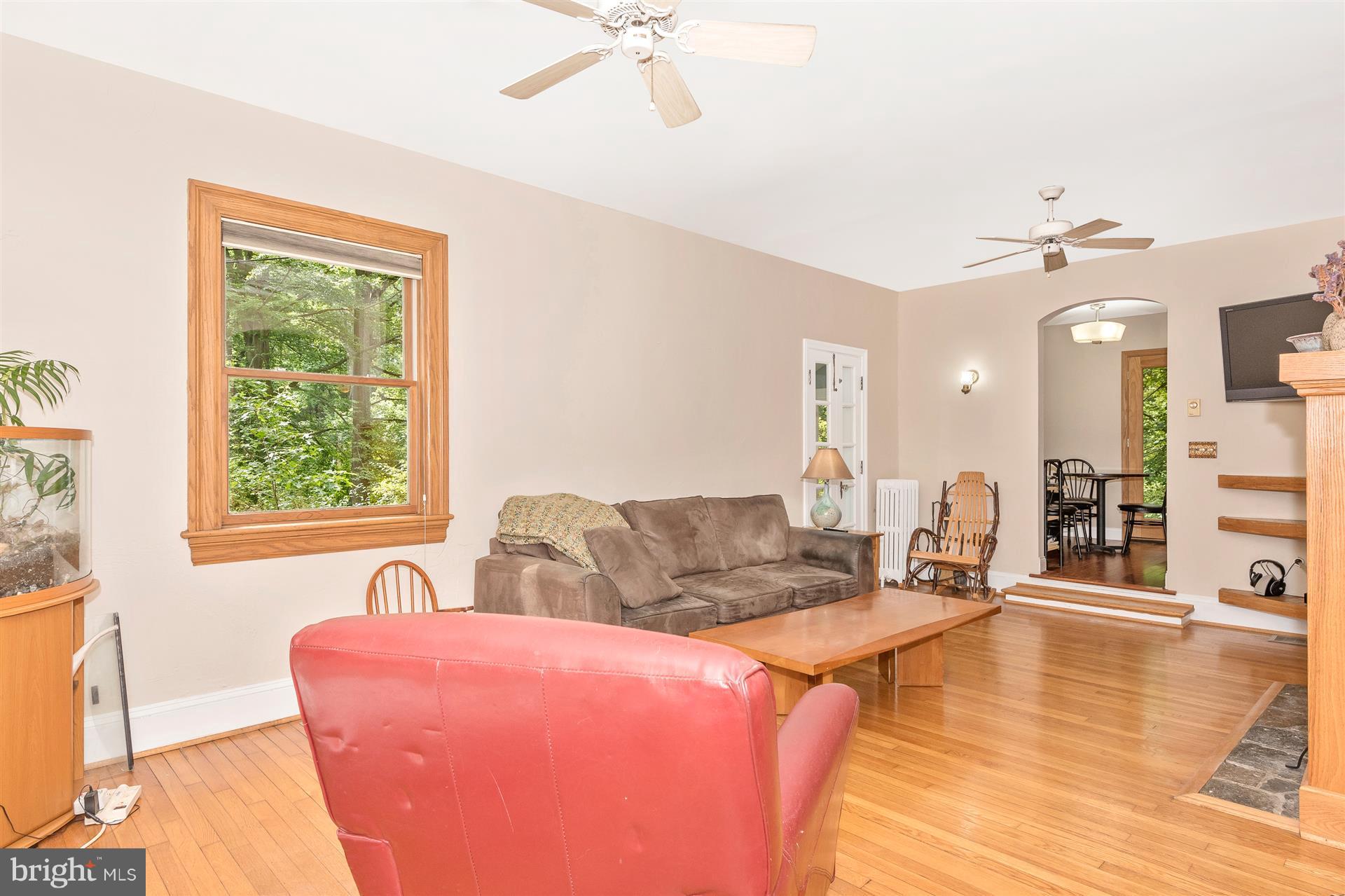 107 Sunnyside Road Silver Spring, MD 20910 - Photo 16 of 26 a living room with furniture and a large window