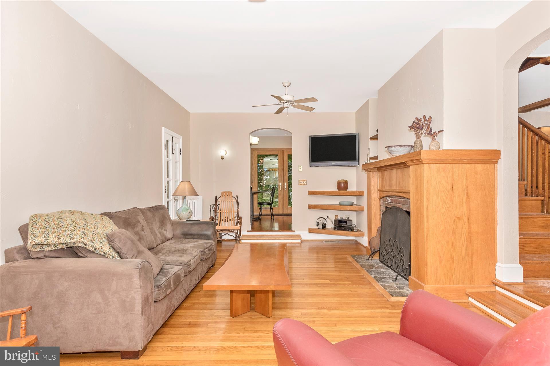 107 Sunnyside Road Silver Spring, MD 20910 - Photo 17 of 26 a living room with furniture and a fireplace