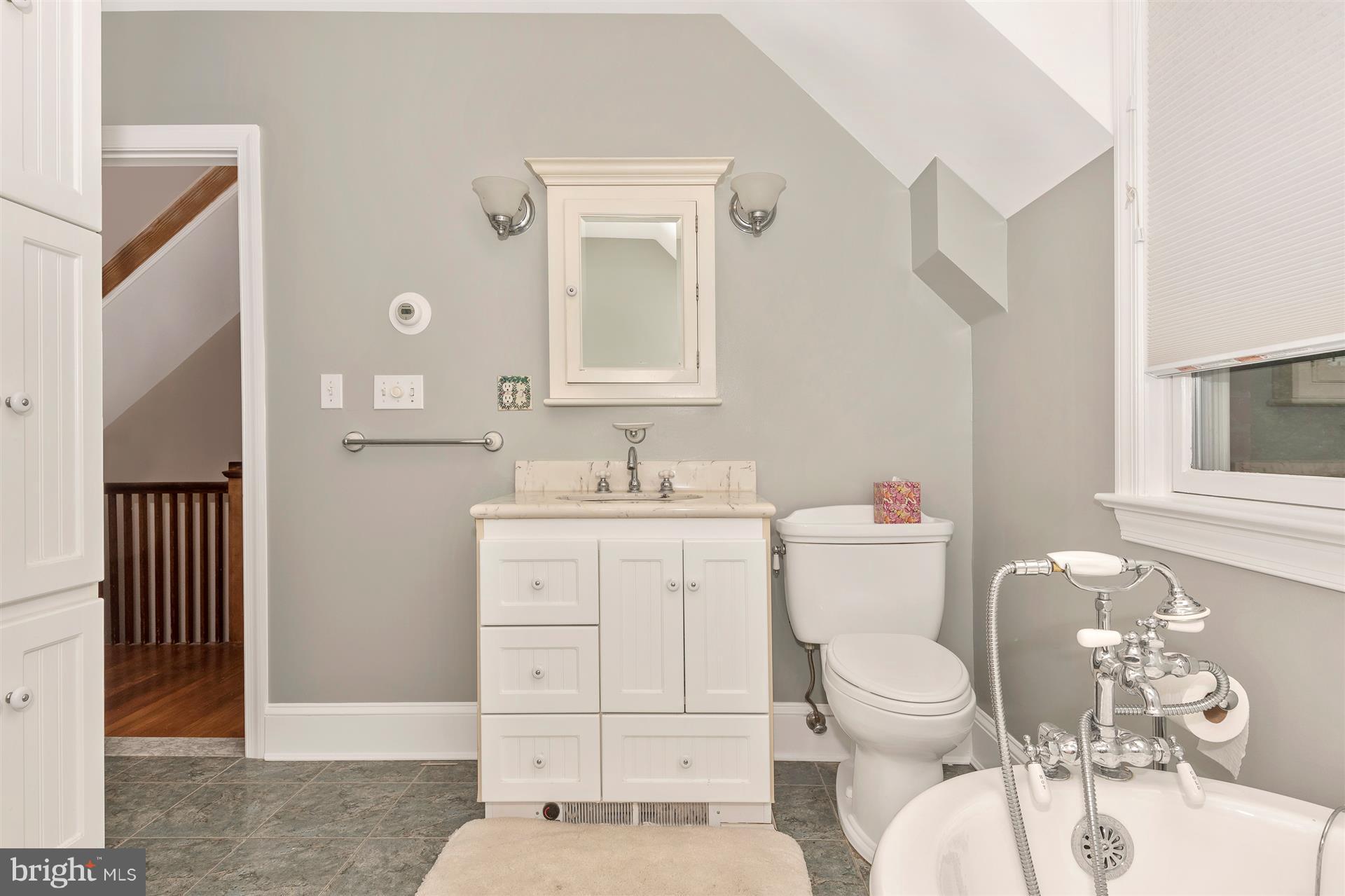 107 Sunnyside Road Silver Spring, MD 20910 - Photo 19 of 26 a bathroom with a sink a toilet and a mirror