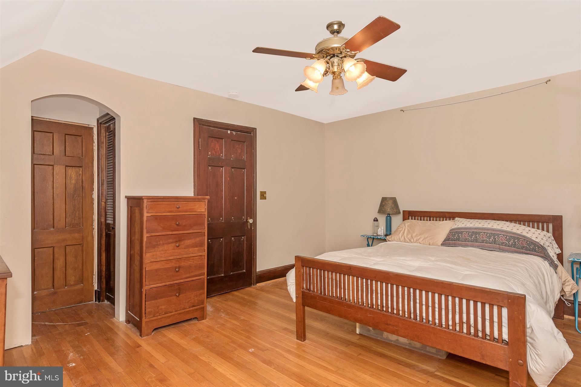 107 Sunnyside Road Silver Spring, MD 20910 - Photo 21 of 26 a bedroom with a bed and a chandelier