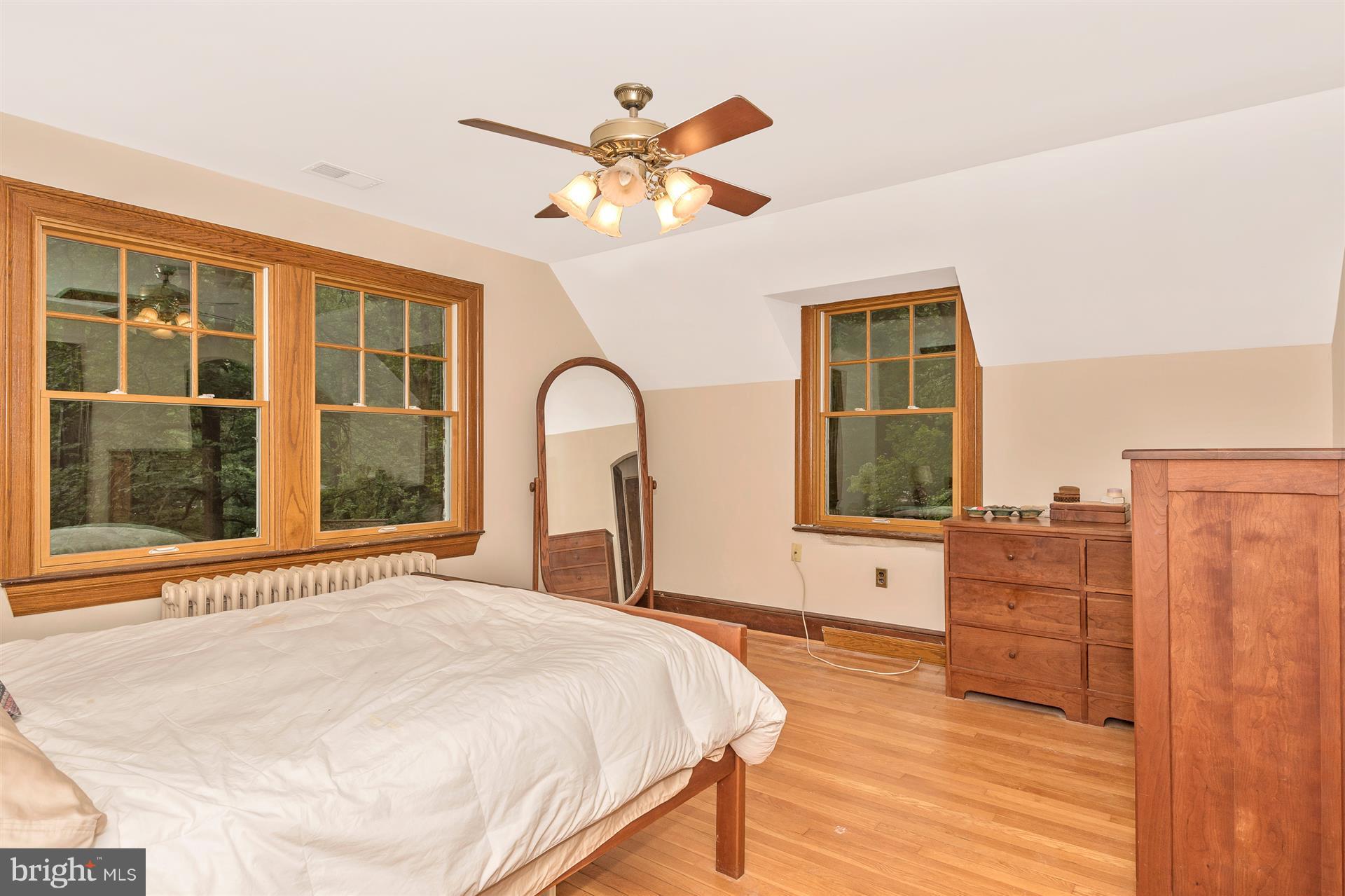 107 Sunnyside Road Silver Spring, MD 20910 - Photo 22 of 26 a bedroom with a large bed and a large window