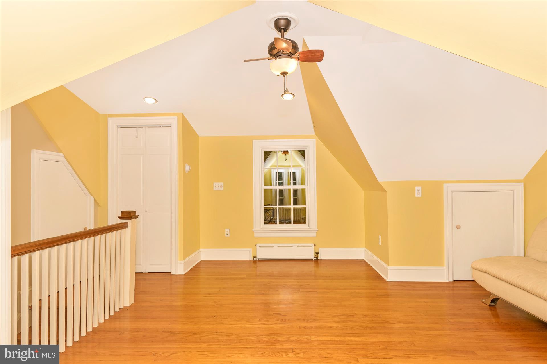 107 Sunnyside Road Silver Spring, MD 20910 - Photo 23 of 26 a view of an empty room with wooden floor