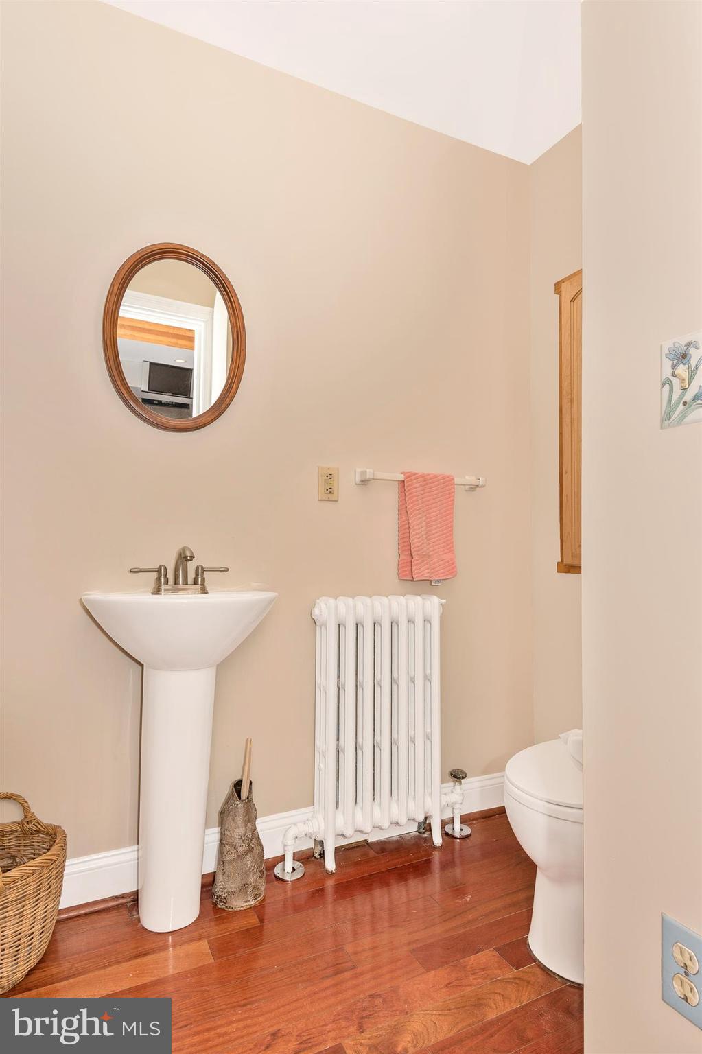 107 Sunnyside Road Silver Spring, MD 20910 - Photo 25 of 26 a bathroom with a sink and a mirror