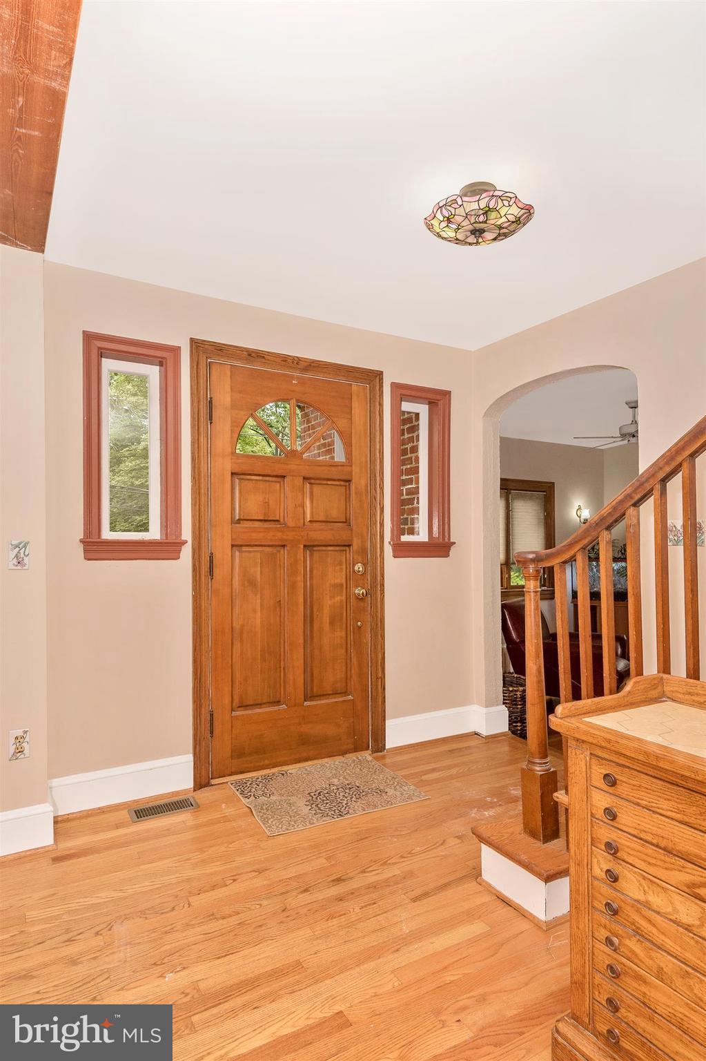 107 Sunnyside Road Silver Spring, MD 20910 - Photo 5 of 26 a view of a livingroom with wooden floor and a window