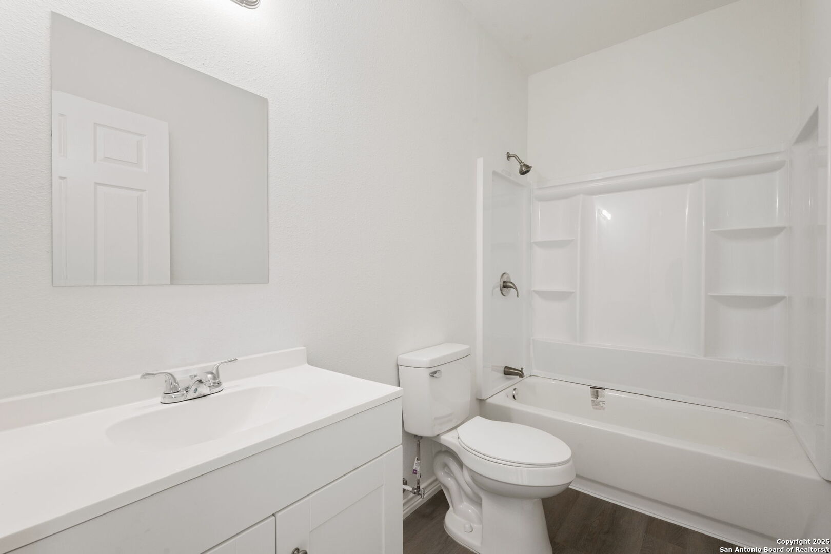 8719 Wurzbach Road, Unit 202 San Antonio, TX 78240 - Photo 10 of 18 a bathroom with a sink a toilet and a bathtub