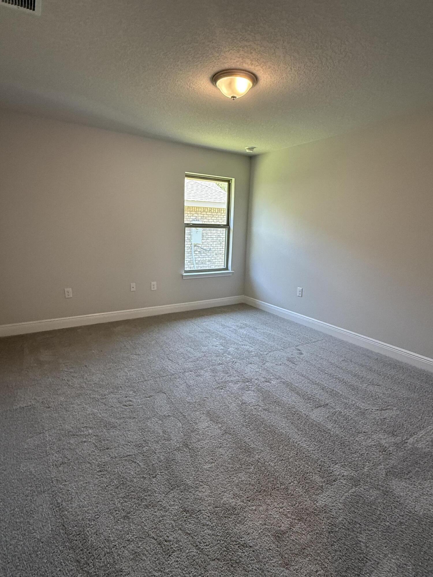 183 Ridgeway Circle Crestview, FL 32536 - Photo 16 of 28 an empty room with a window