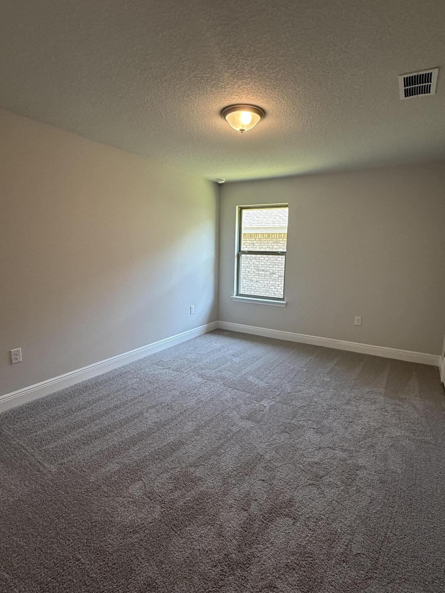 183 Ridgeway Circle Crestview, FL 32536 - Photo 20 of 28 an empty room with a windows and closet