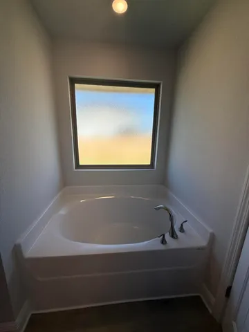 a bathroom with a glass shower door