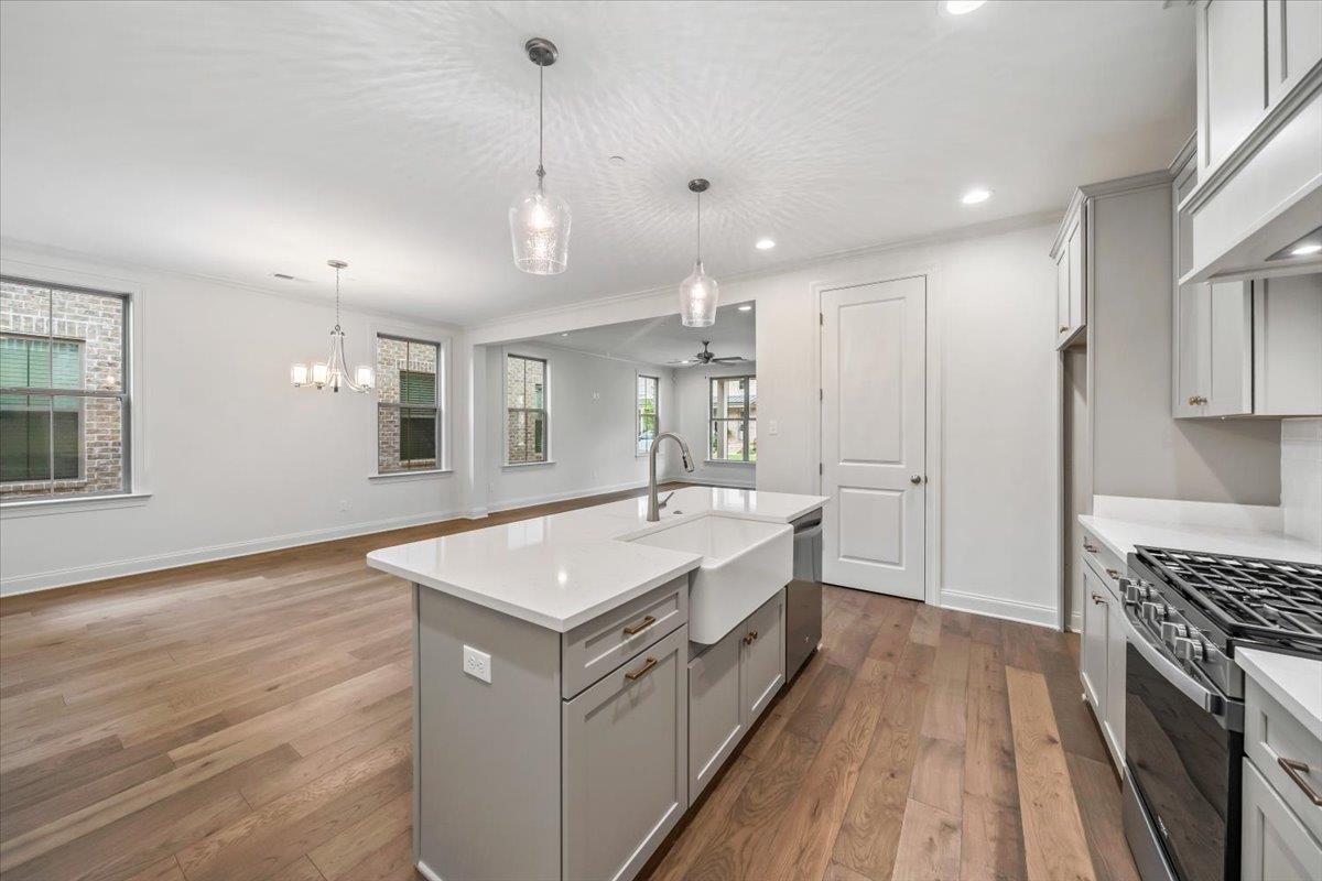 499 Armel Drive Collierville, TN 38017 - Photo 15 of 40 a spacious bathroom with a granite countertop sink a mirror and a bathtub