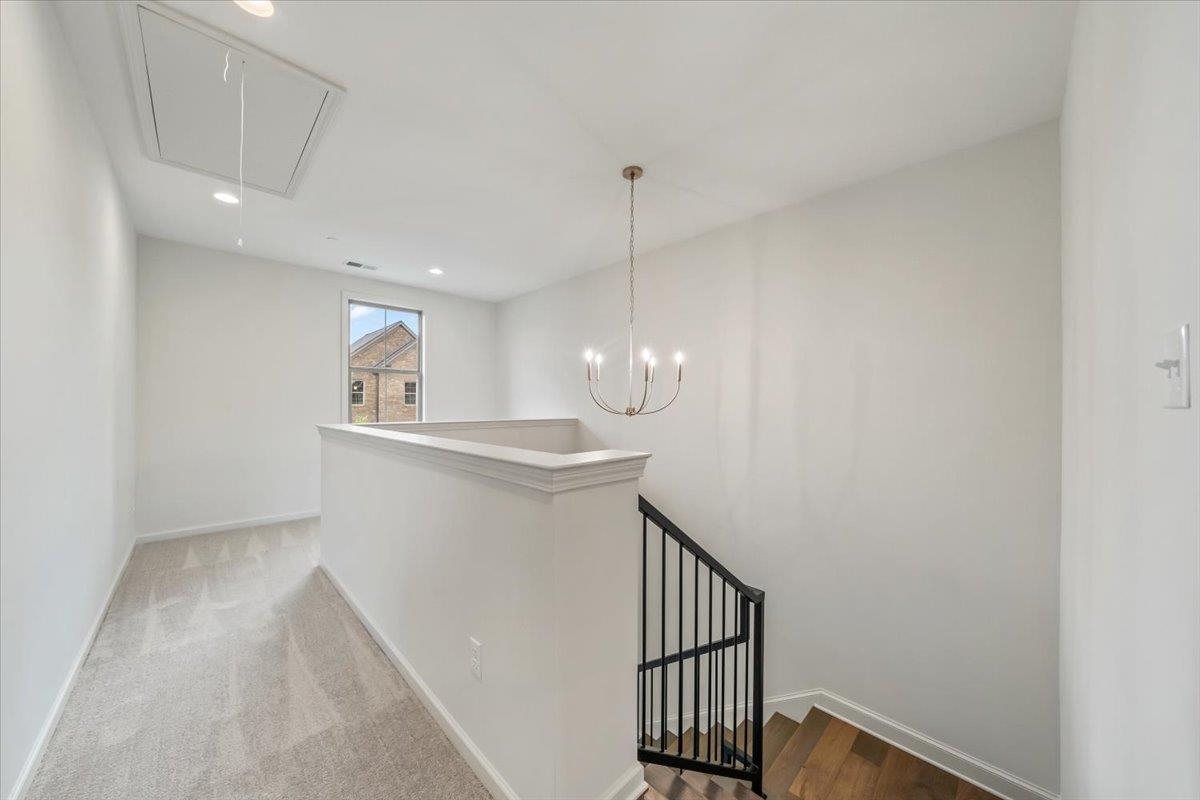 499 Armel Drive Collierville, TN 38017 - Photo 21 of 40 a view of a hallway with a sink and a window