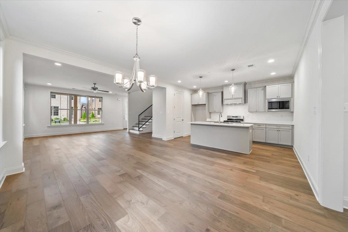 499 Armel Drive Collierville, TN 38017 - Photo 10 of 40 a view of a kitchen with cabinets and wooden floor