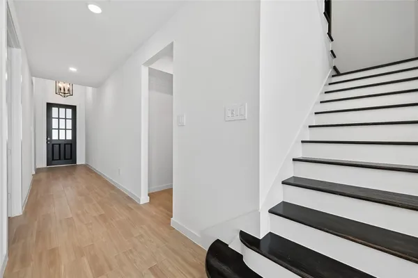 a view of entryway with wooden floor