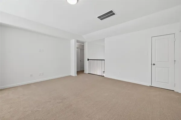 a view of an empty room and entryway