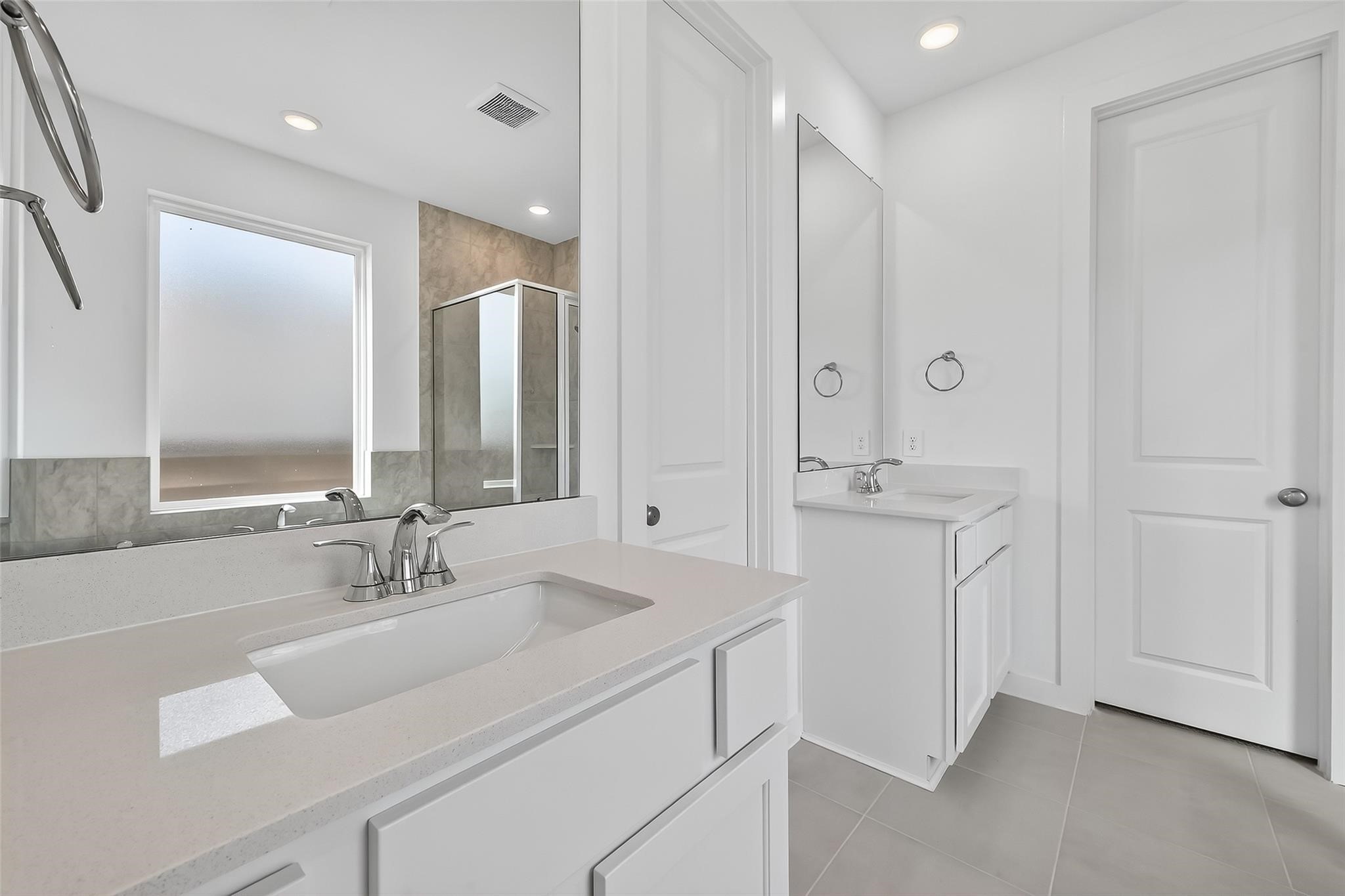 3222 Kindred Way Richmond, TX 77406 - Photo 43 of 50 a bathroom with 2 sink and a mirror