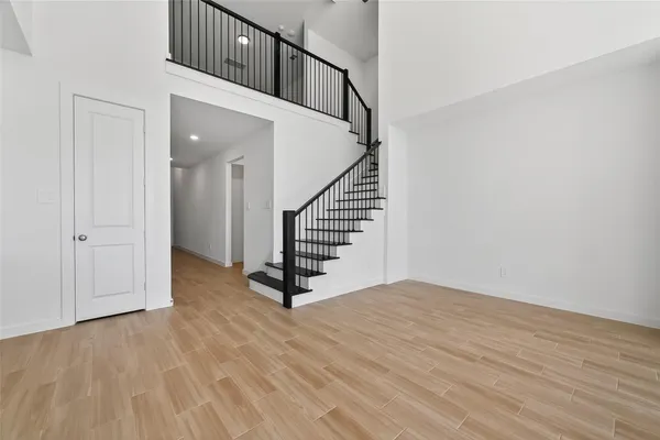 a view of an entryway with wooden floor