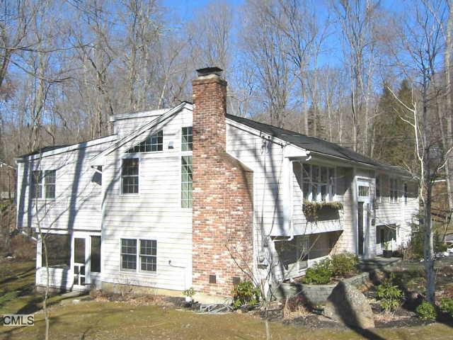 60 Riverside Drive Ridgefield, CT 06877 - Photo 1 of 1 a front view of a building with street view