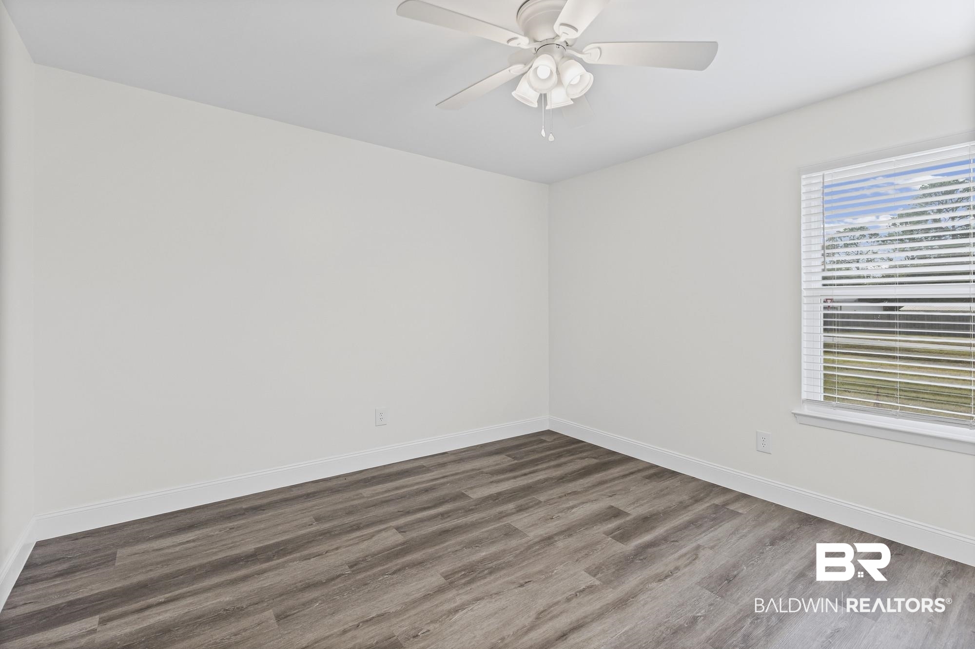 3041 Pretty Branch Drive East Mobile, AL 36618 - Photo 16 of 20 Unfurnished room with wood finished floors and a ceiling fan