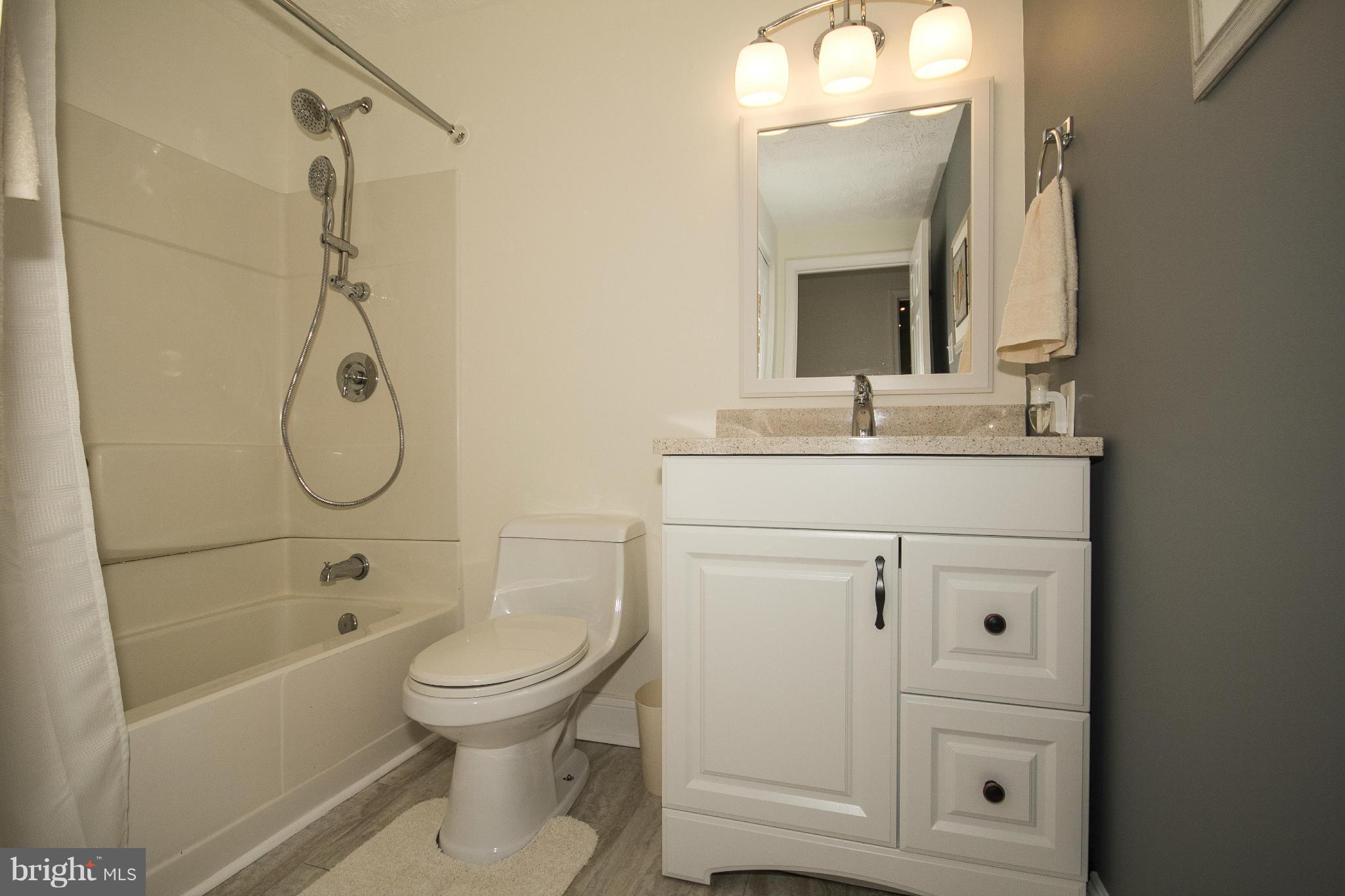 710 Highvilla Road Baltimore, MD 21221 - Photo 23 of 30 a bathroom with a bath tub sink mirror and toilet