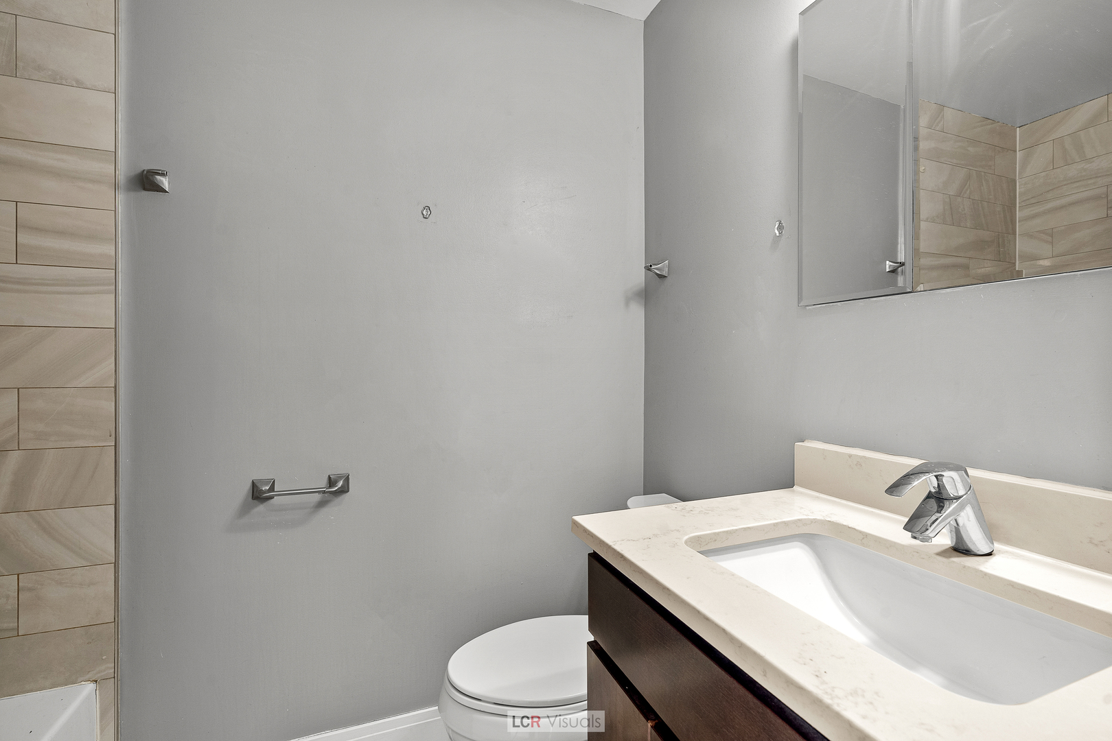 3422 West 13th Place, Unit 2 Chicago, IL 60623 - Photo 11 of 13 a bathroom with a sink toilet and vanity