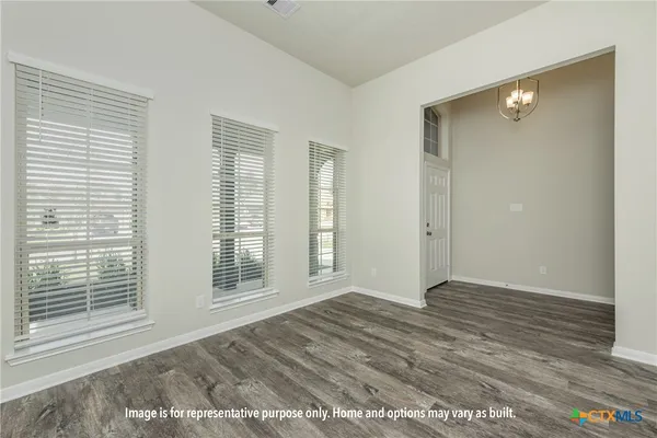 a large kitchen with stainless steel appliances granite countertop a stove and a sink