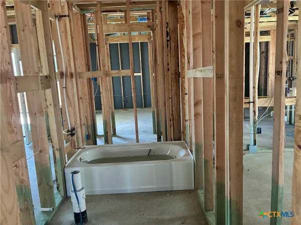 a living room with a couch and a door