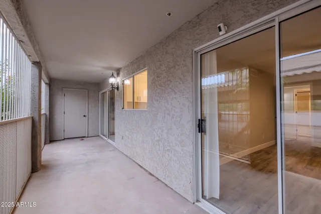 a view of an empty room with a glass door