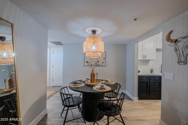 a view of a dining room with furniture and wooden floor
