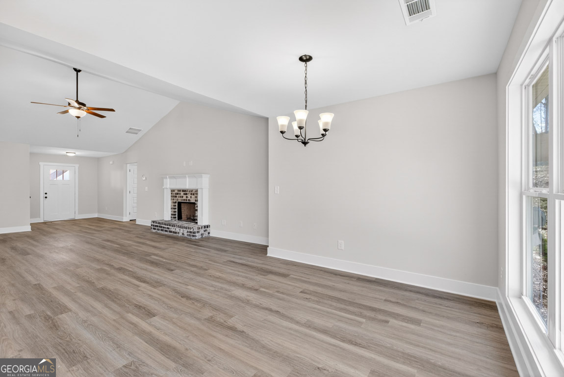 110 Chad Walk, Unit 56 Statham, GA 30666 - Photo 12 of 53 wooden floor in an empty room with a window