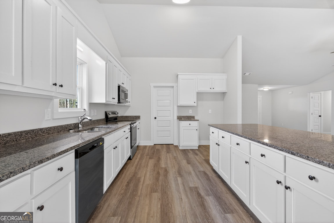 110 Chad Walk, Unit 56 Statham, GA 30666 - Photo 20 of 53 a large kitchen with cabinets