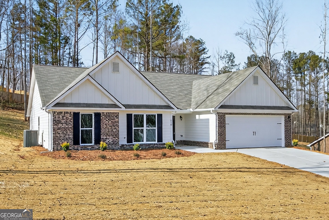 110 Chad Walk, Unit 56 Statham, GA 30666 - Photo 2 of 53 a front view of a house with a yard