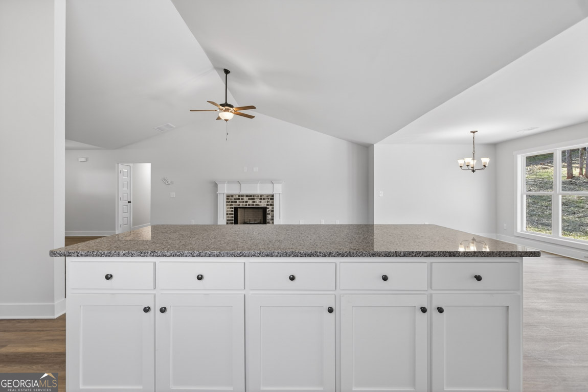 110 Chad Walk, Unit 56 Statham, GA 30666 - Photo 24 of 53 a kitchen with granite countertop a sink and cabinets