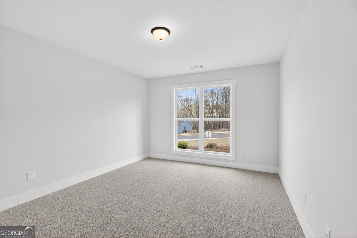 110 Chad Walk, Unit 56 Statham, GA 30666 - Photo 27 of 53 an empty room with a window