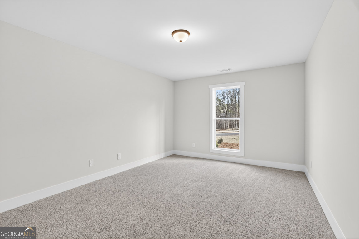 110 Chad Walk, Unit 56 Statham, GA 30666 - Photo 31 of 53 a view of an empty room with a window