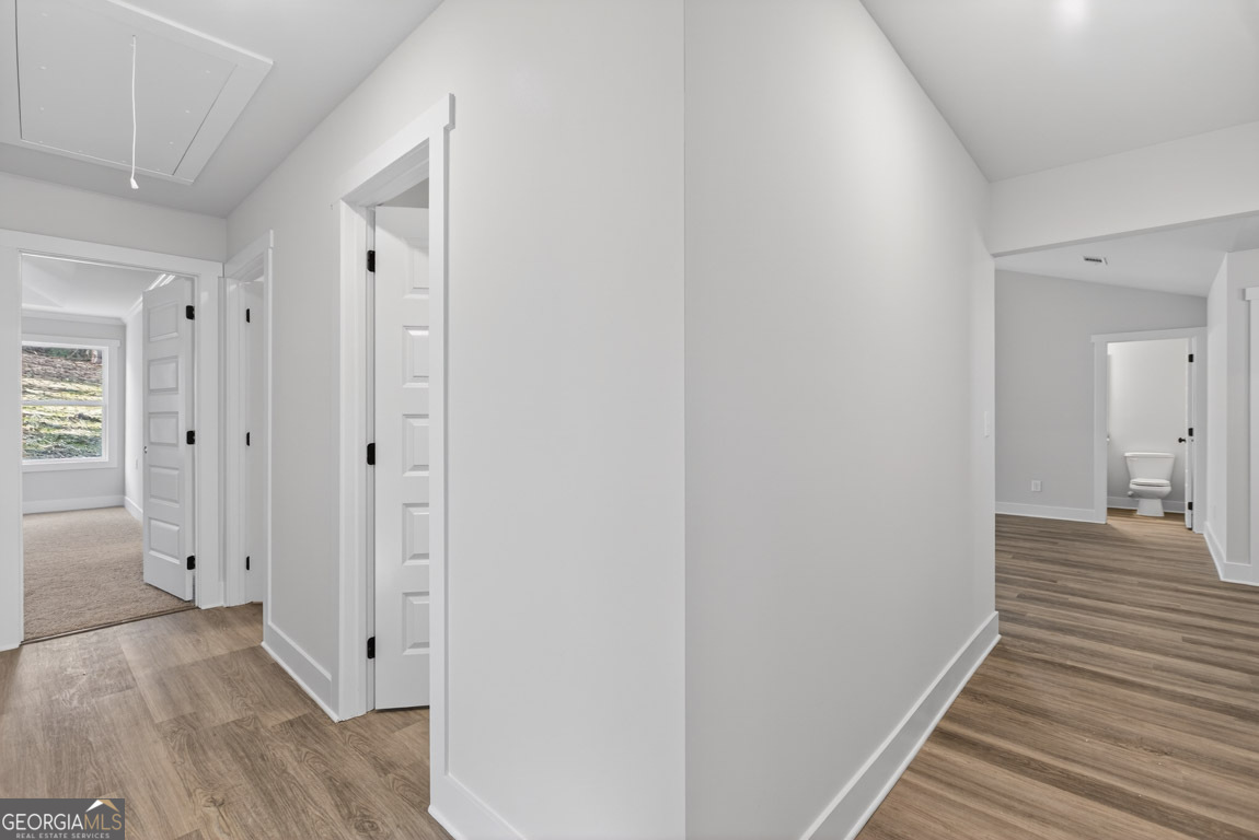 110 Chad Walk, Unit 56 Statham, GA 30666 - Photo 32 of 53 a view of a hallway with wooden floor