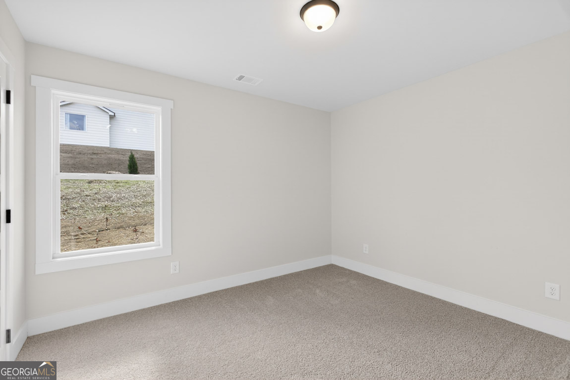 110 Chad Walk, Unit 56 Statham, GA 30666 - Photo 33 of 53 an empty room with a window