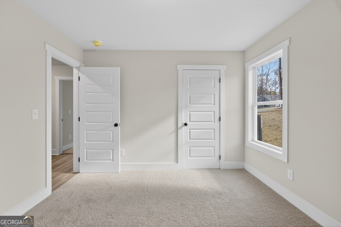 110 Chad Walk, Unit 56 Statham, GA 30666 - Photo 35 of 53 an empty room with windows and closet
