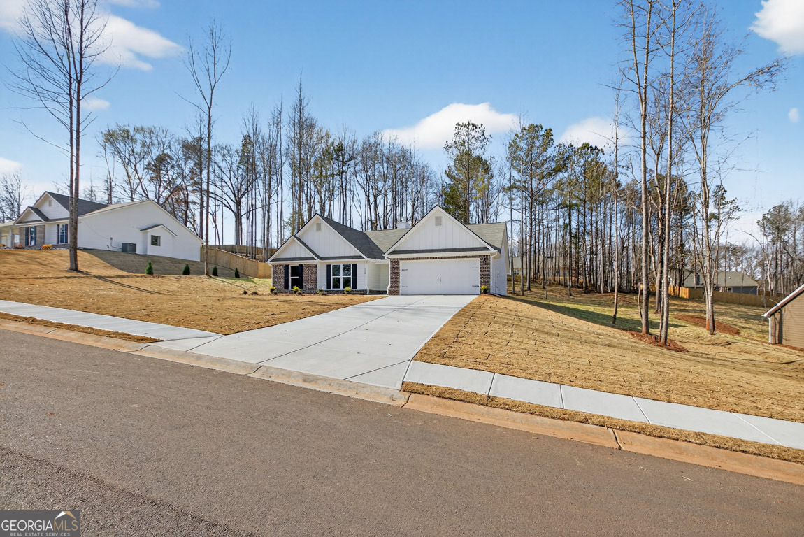 110 Chad Walk, Unit 56 Statham, GA 30666 - Photo 4 of 53 a house with trees in the background