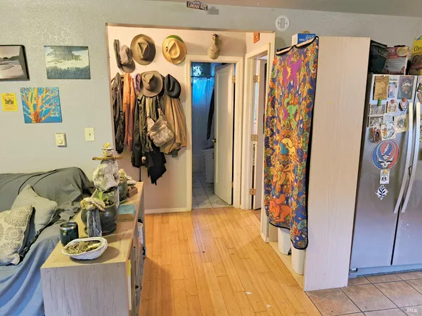 a view of walk in closet with clothes