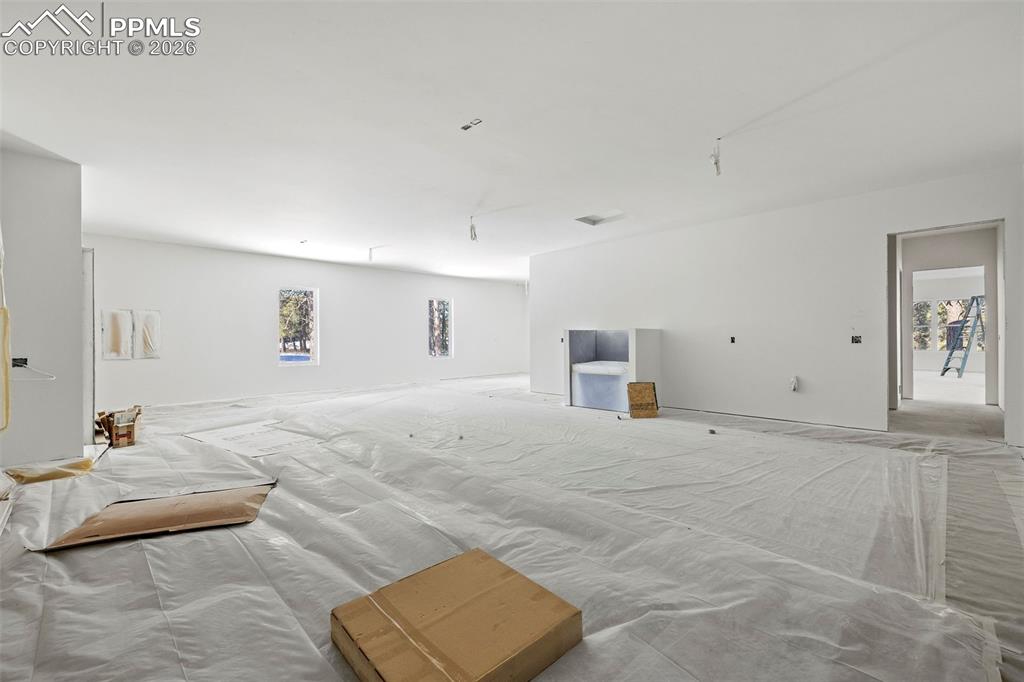 10697 Alamar Way Colorado Springs, CO 80908 - Photo 11 of 24 a view of a livingroom with wooden floor and cabinet