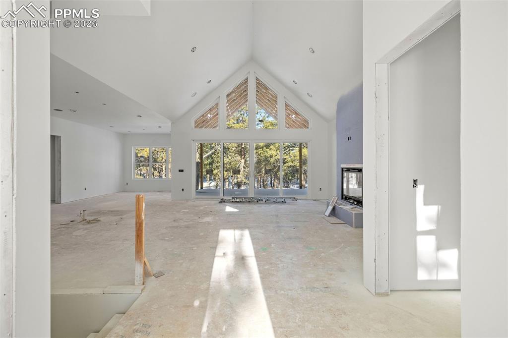 10697 Alamar Way Colorado Springs, CO 80908 - Photo 14 of 24 a view of entryway with wooden floor and a rug