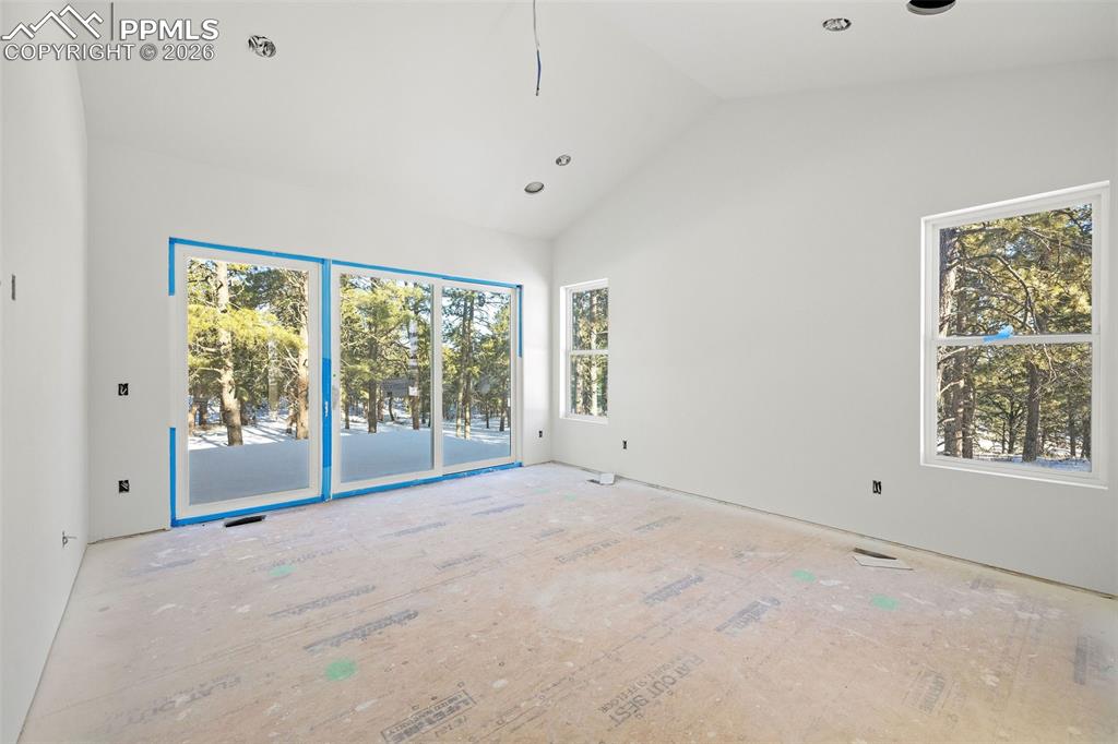 10697 Alamar Way Colorado Springs, CO 80908 - Photo 15 of 24 a view of an empty room with a window