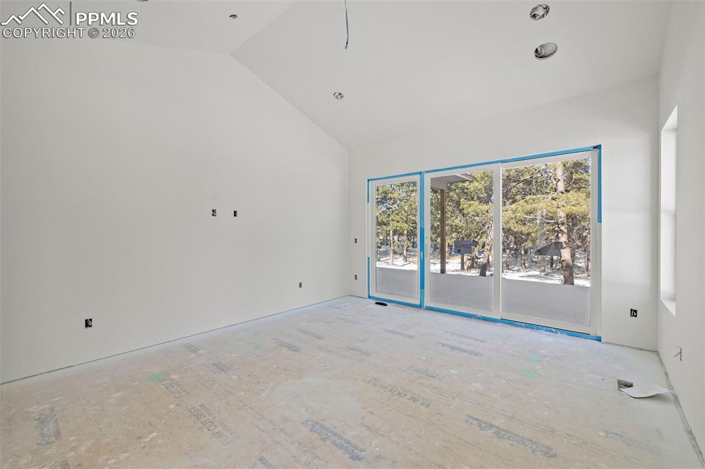 10697 Alamar Way Colorado Springs, CO 80908 - Photo 17 of 24 a view of an empty room with a window