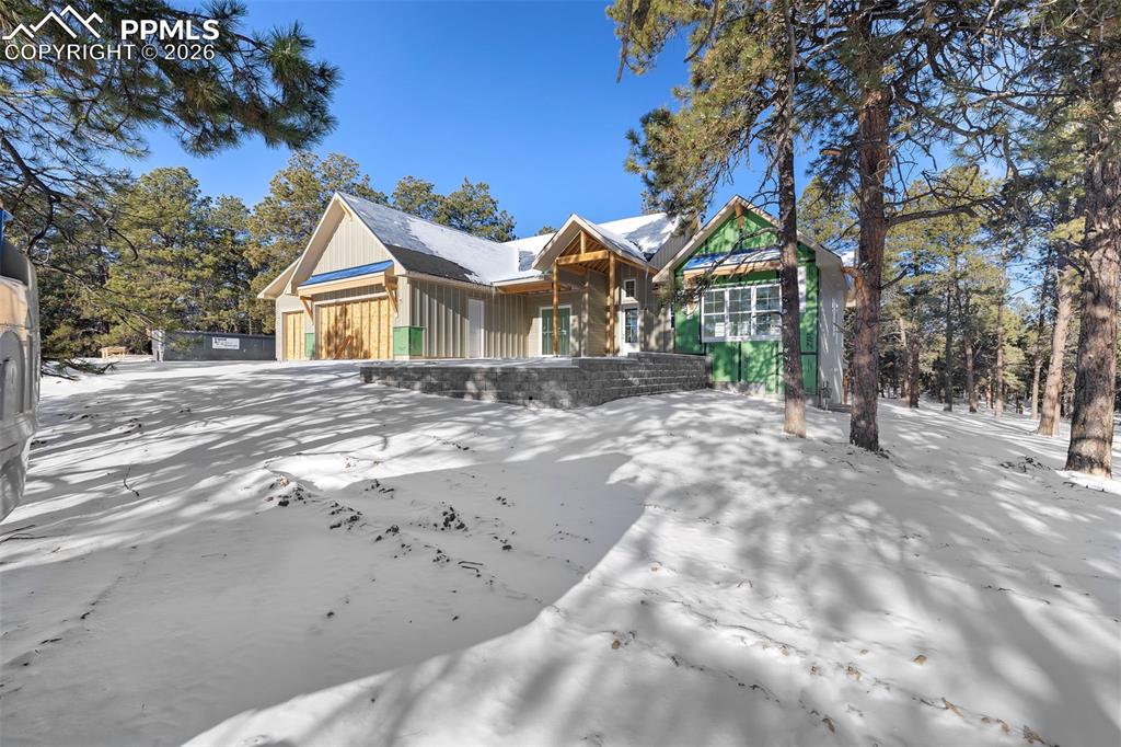 10697 Alamar Way Colorado Springs, CO 80908 - Photo 2 of 24 a front view of a house with a yard