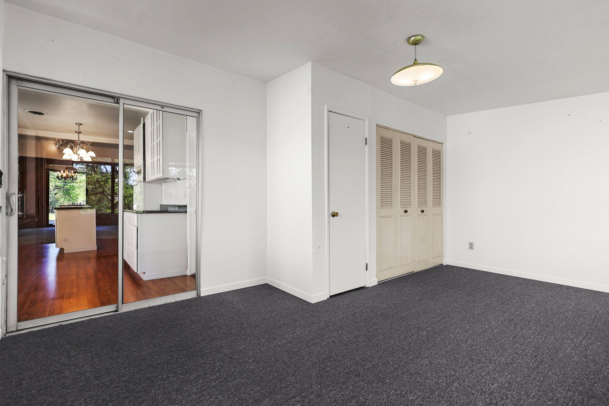 16588 Stanislaus Drive Redding, CA 96001 - Photo 20 of 53 a view of empty room with wooden floor