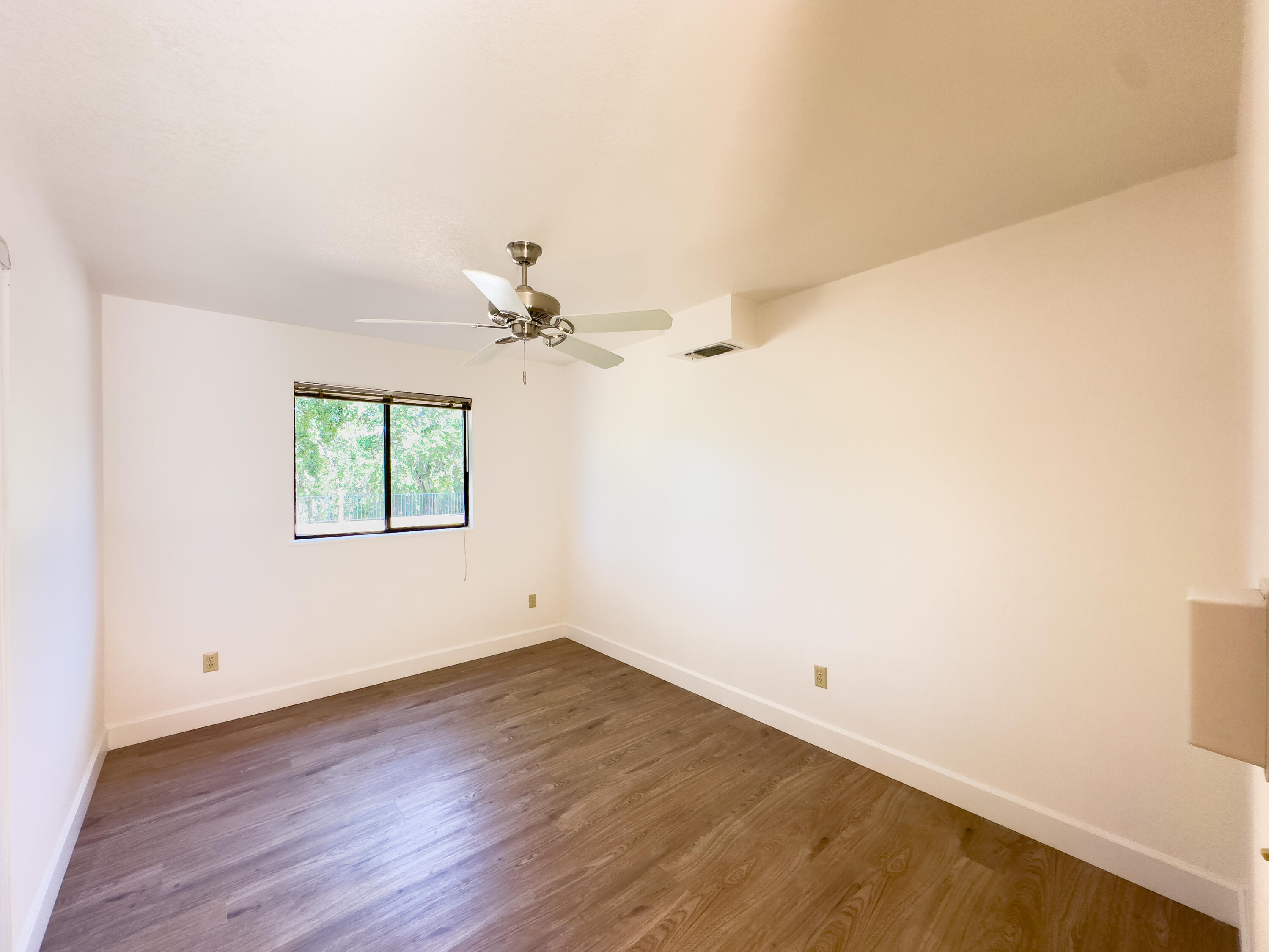 16588 Stanislaus Drive Redding, CA 96001 - Photo 25 of 53 wooden floor in an empty room