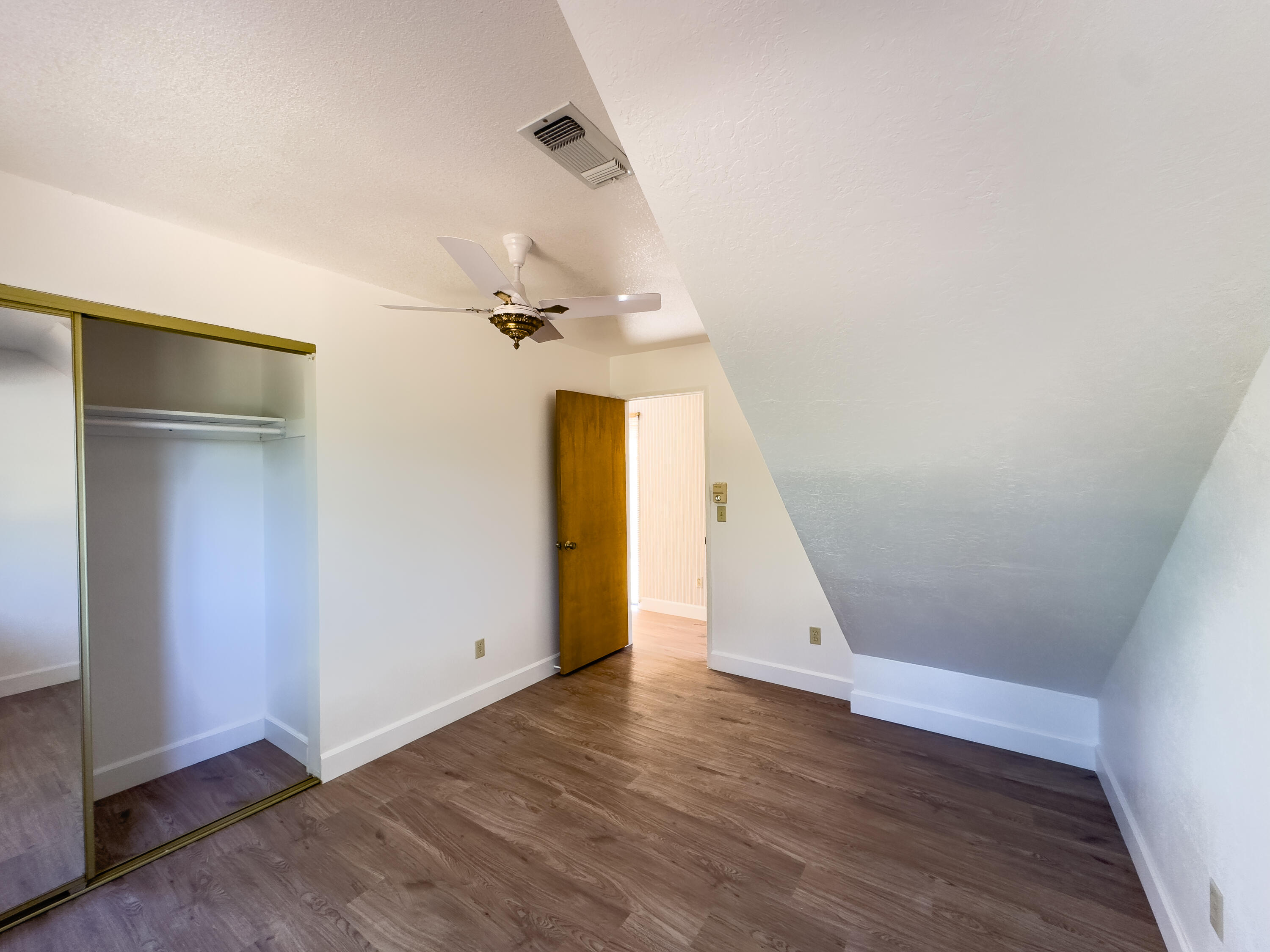 16588 Stanislaus Drive Redding, CA 96001 - Photo 28 of 53 an empty room with wooden floor and entryway